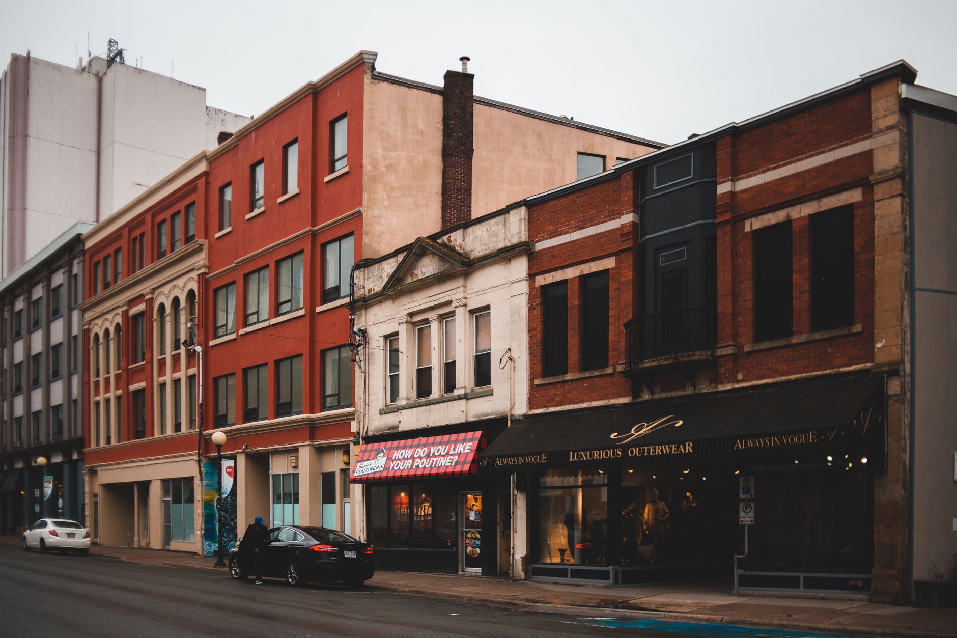 A downtown Connecticut street with storefronts and brick buildings